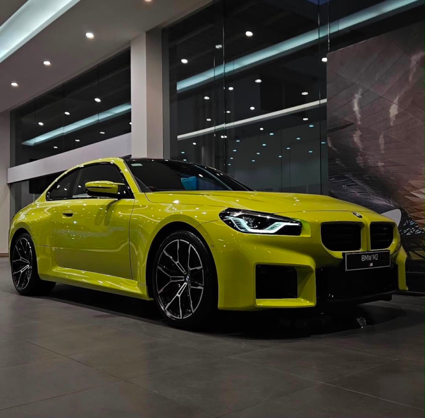 BMW M2 side profile at BMW Center showroom